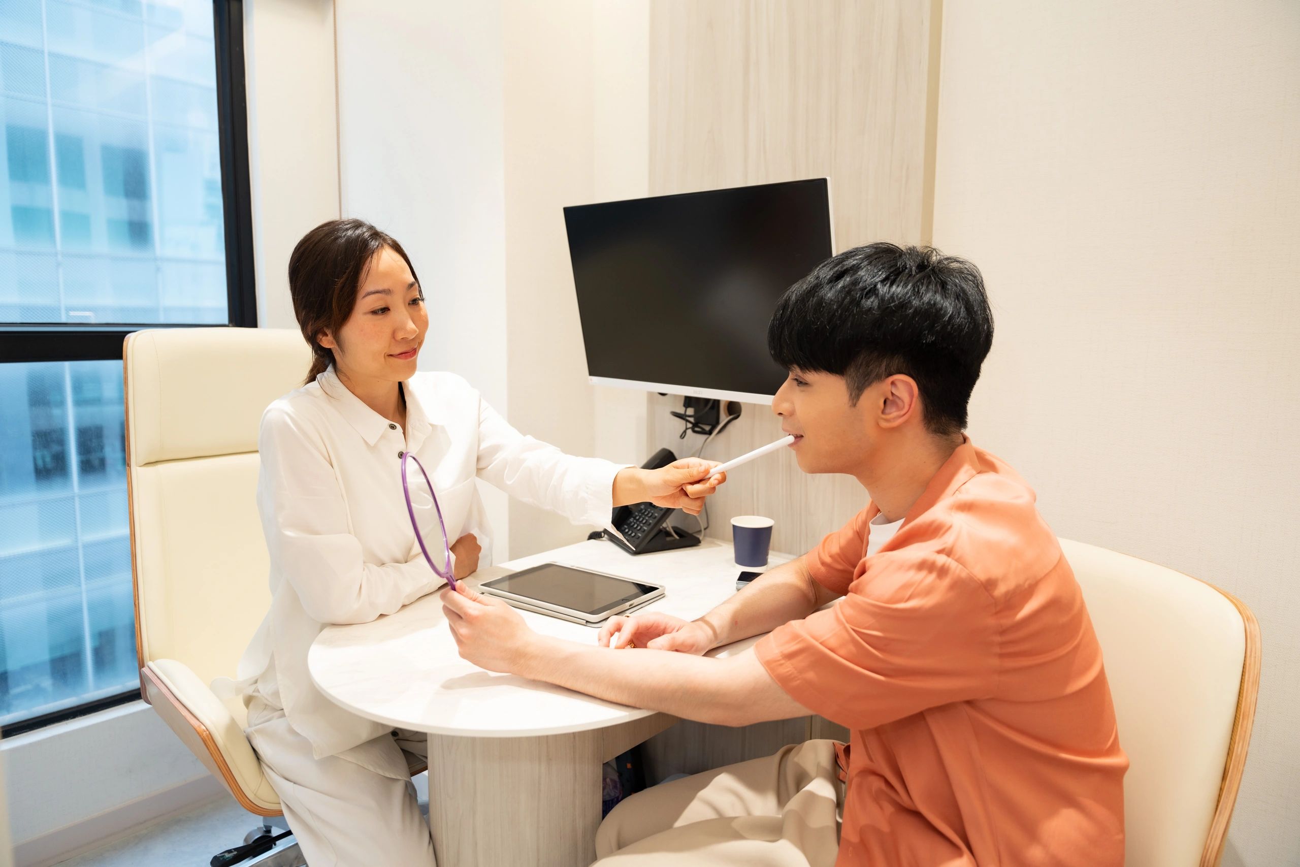 Doctor consulting with a patient in a modern clinic