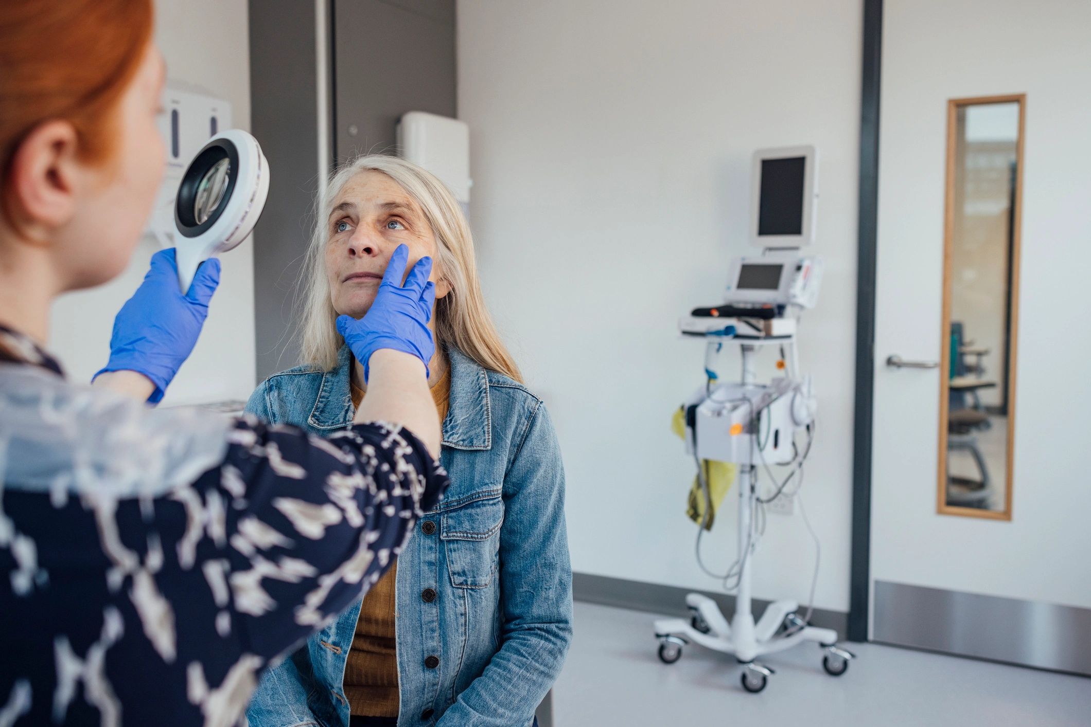 Doctor examining a patient carefully