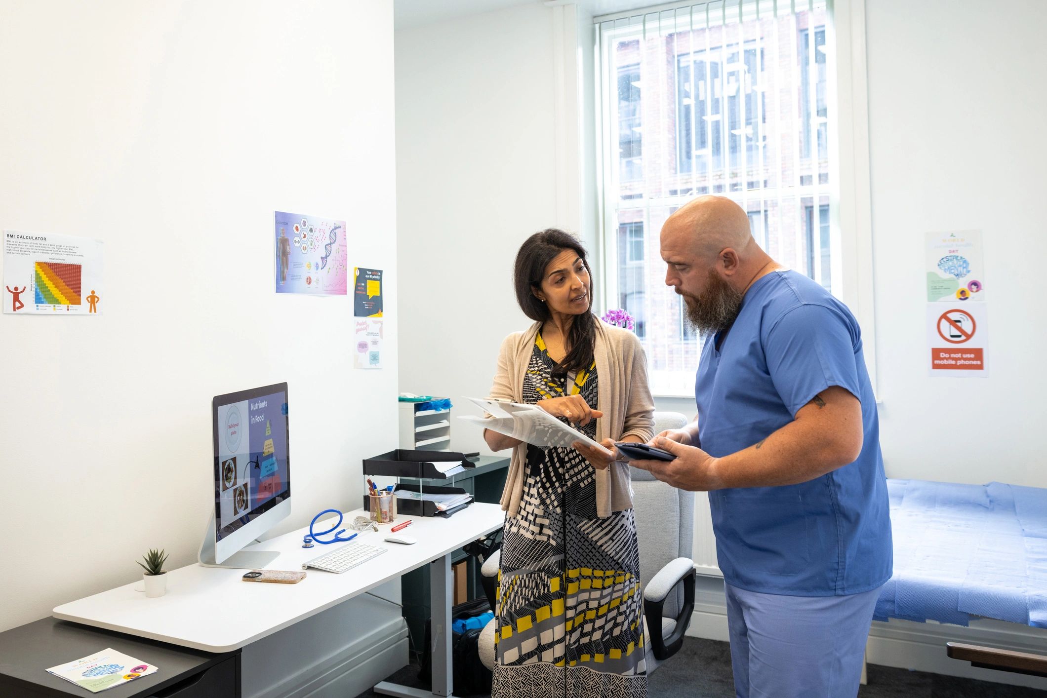 Eye care team consulting in a modern clinic