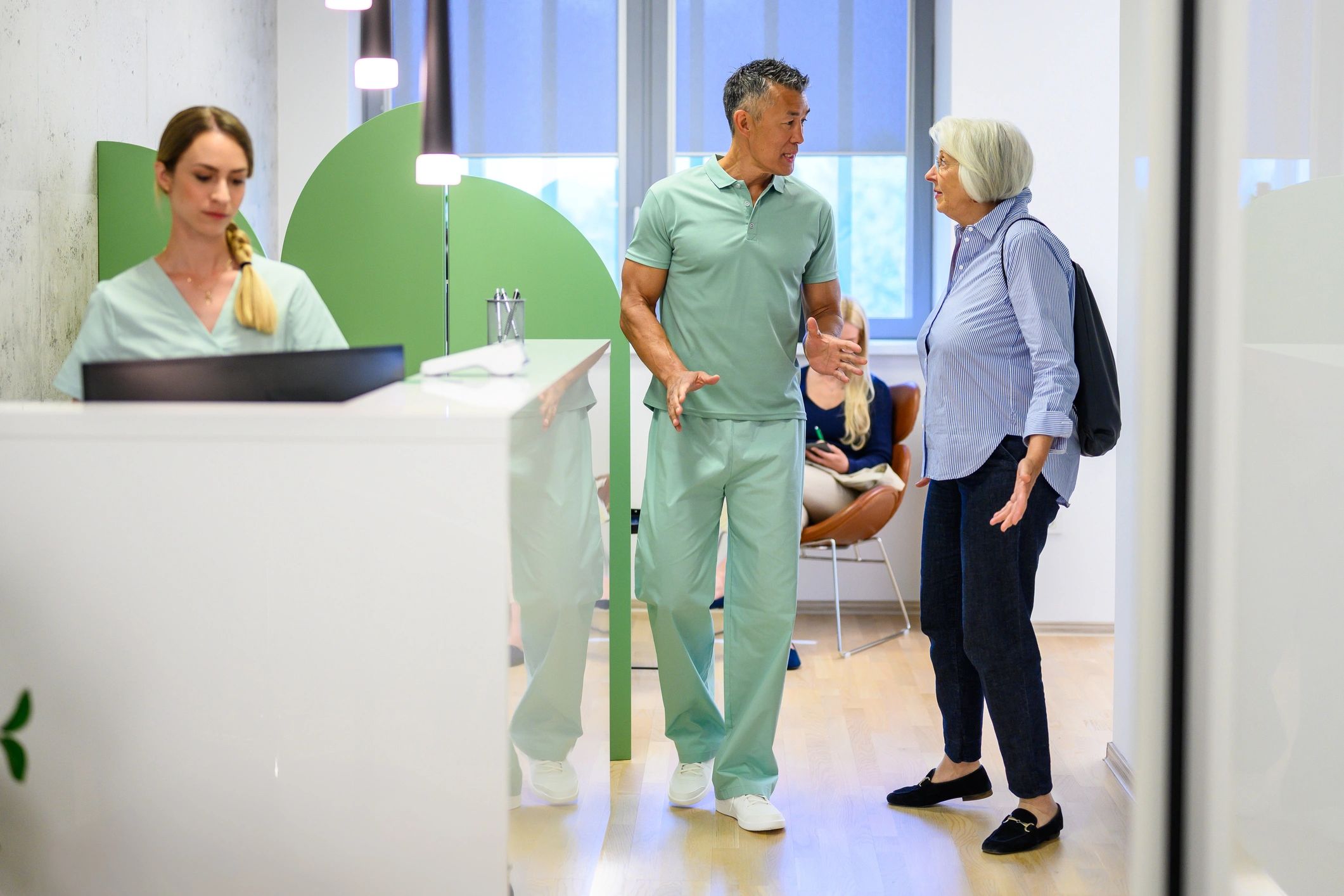Healthcare professional consulting with a patient in a modern clinic