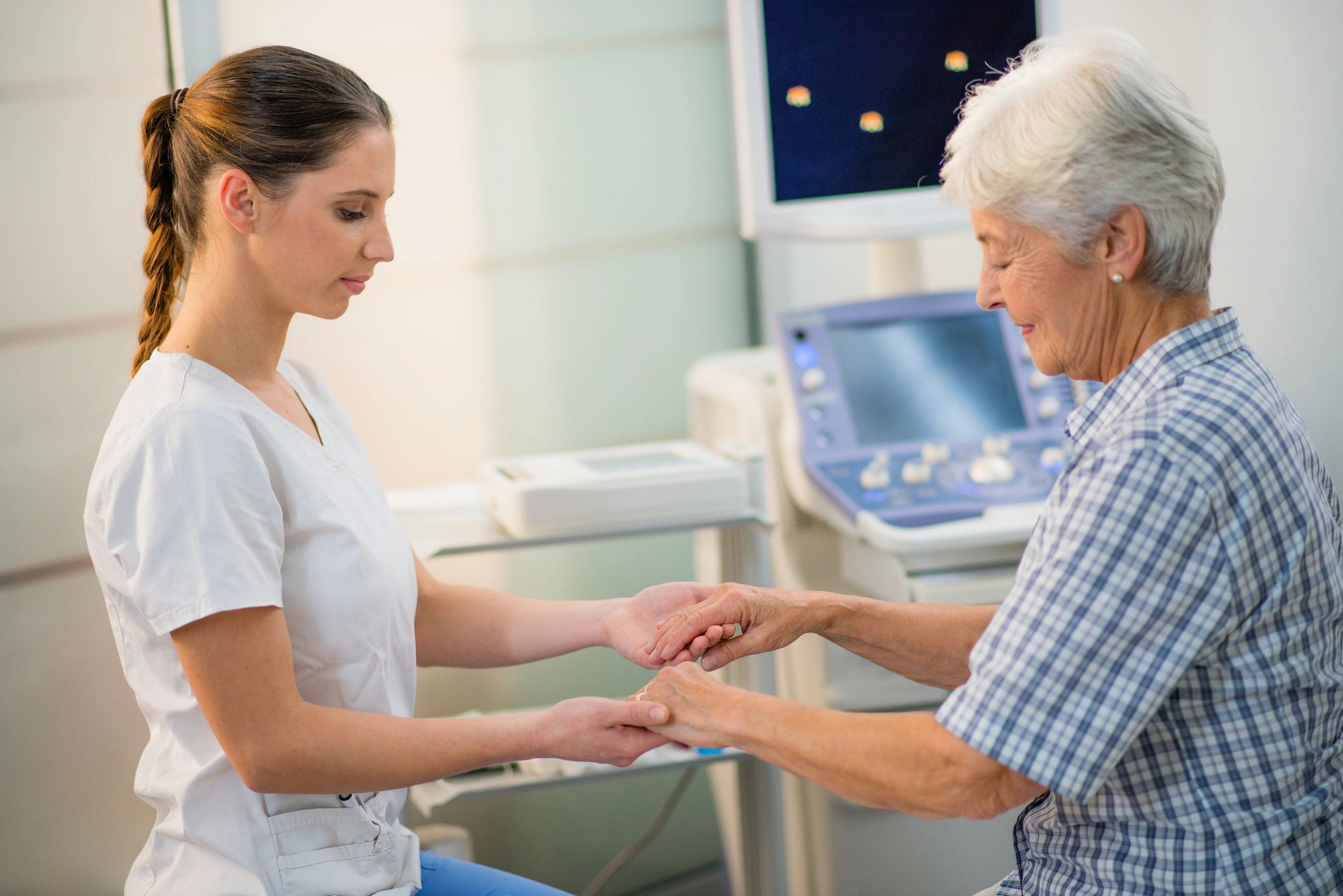 Doctor reassuring a patient during care